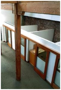 Before: view of solid office cubicles from above before rehabilitation